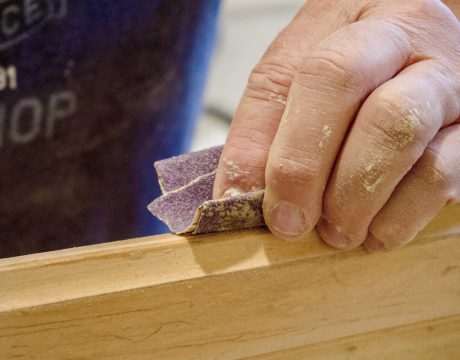 closeup-of-manually-sanding-of-wood-with-sandpaper-2022-11-16-00-05-02-utc