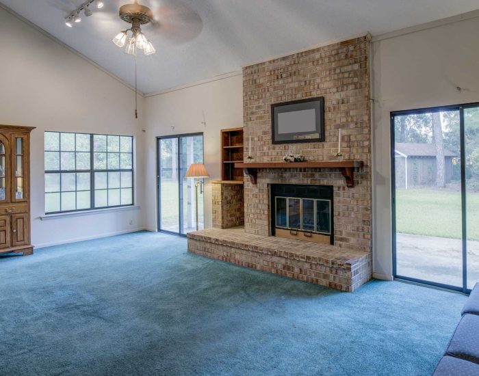 Simple living room in need of remodel.